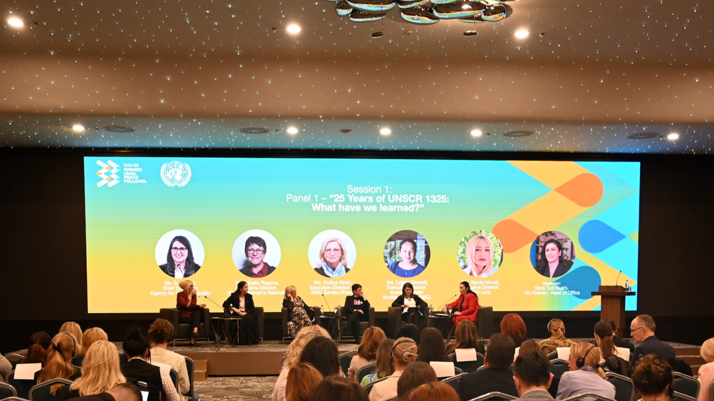 people sitting on a panel for the 25th anniversary of wps