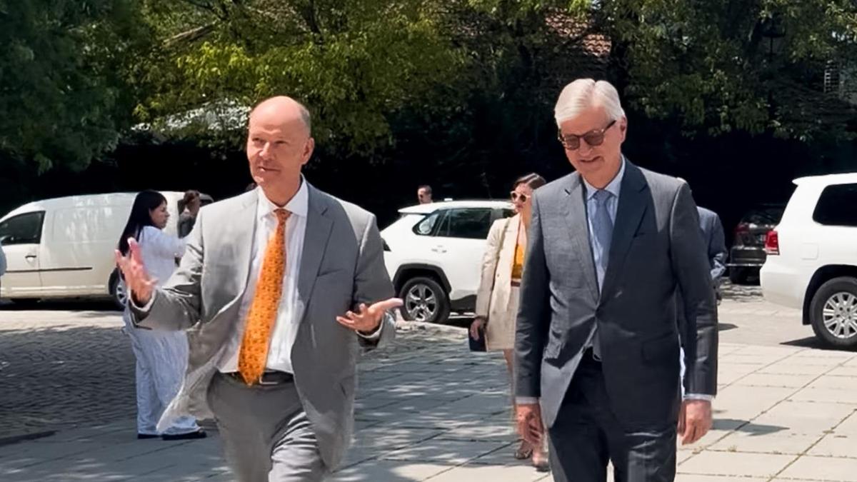 Two men in suits walking 