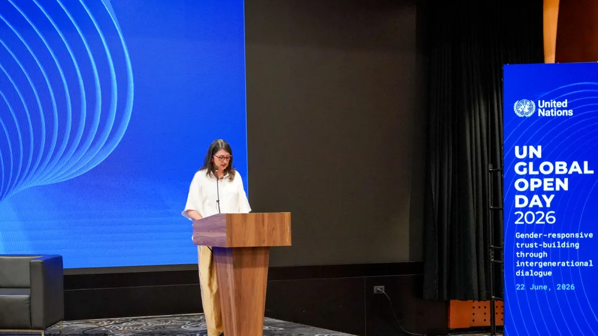 Woman speaking at podium 