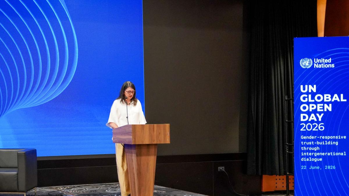 Woman speaking at podium 