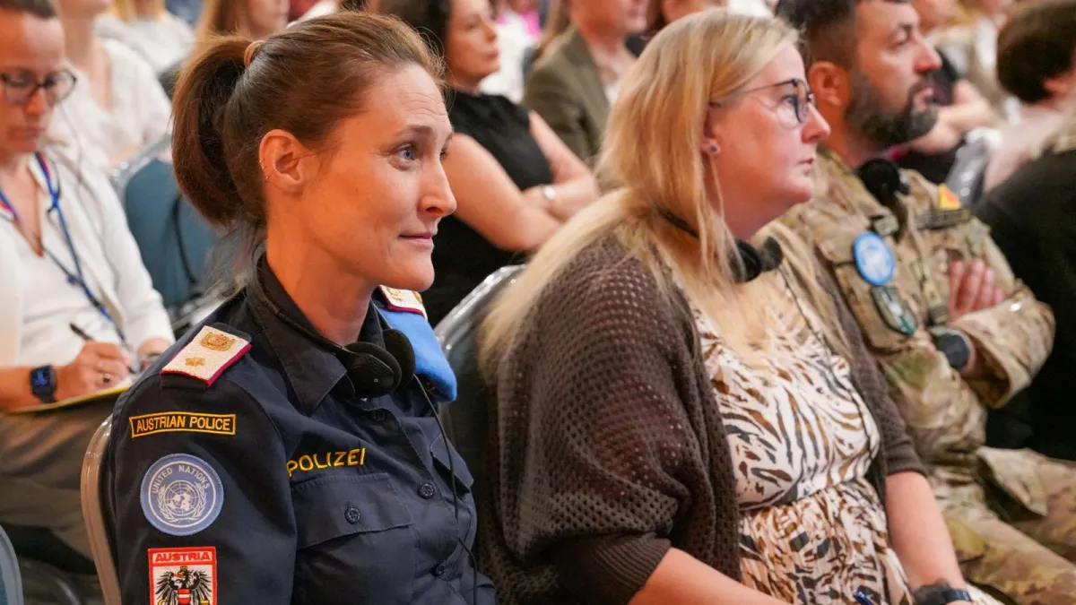 UNPOL Police officer sitting in an audience 