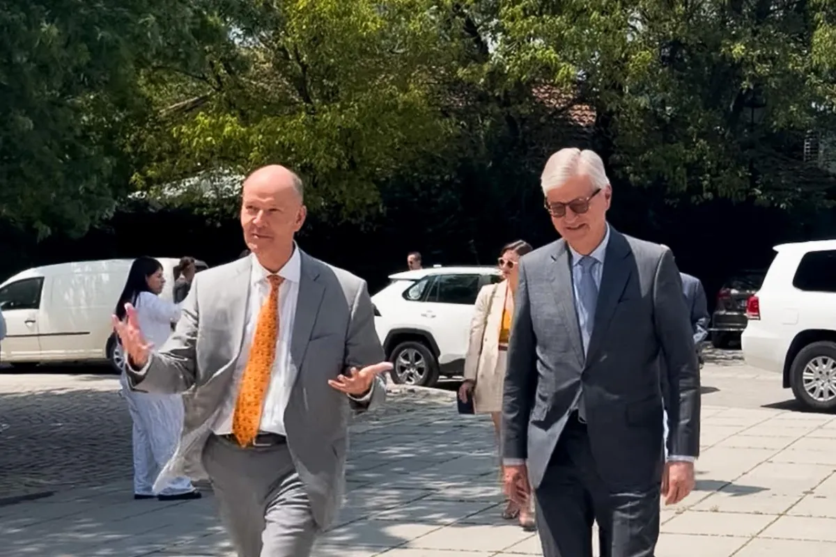 Two men in suits walking 