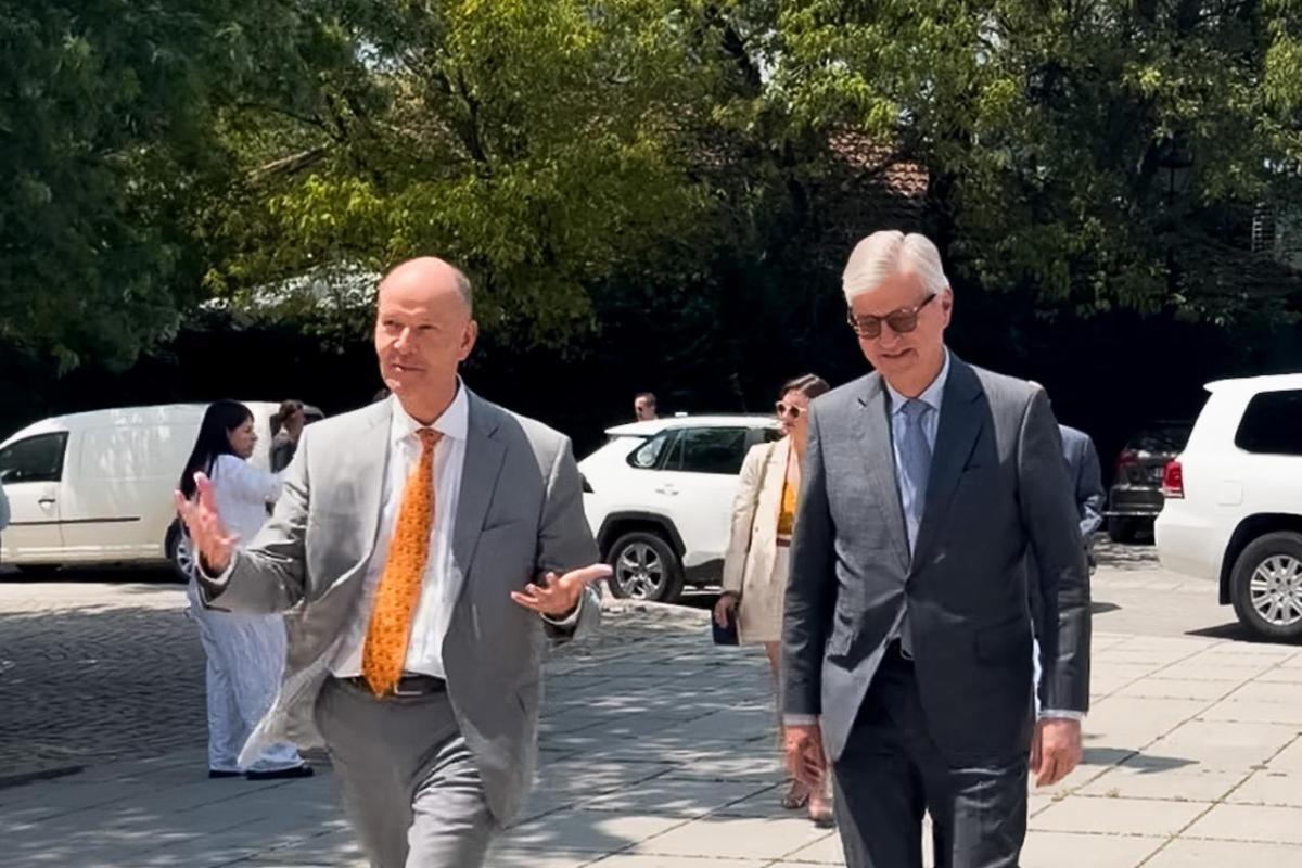 Two men in suits walking 