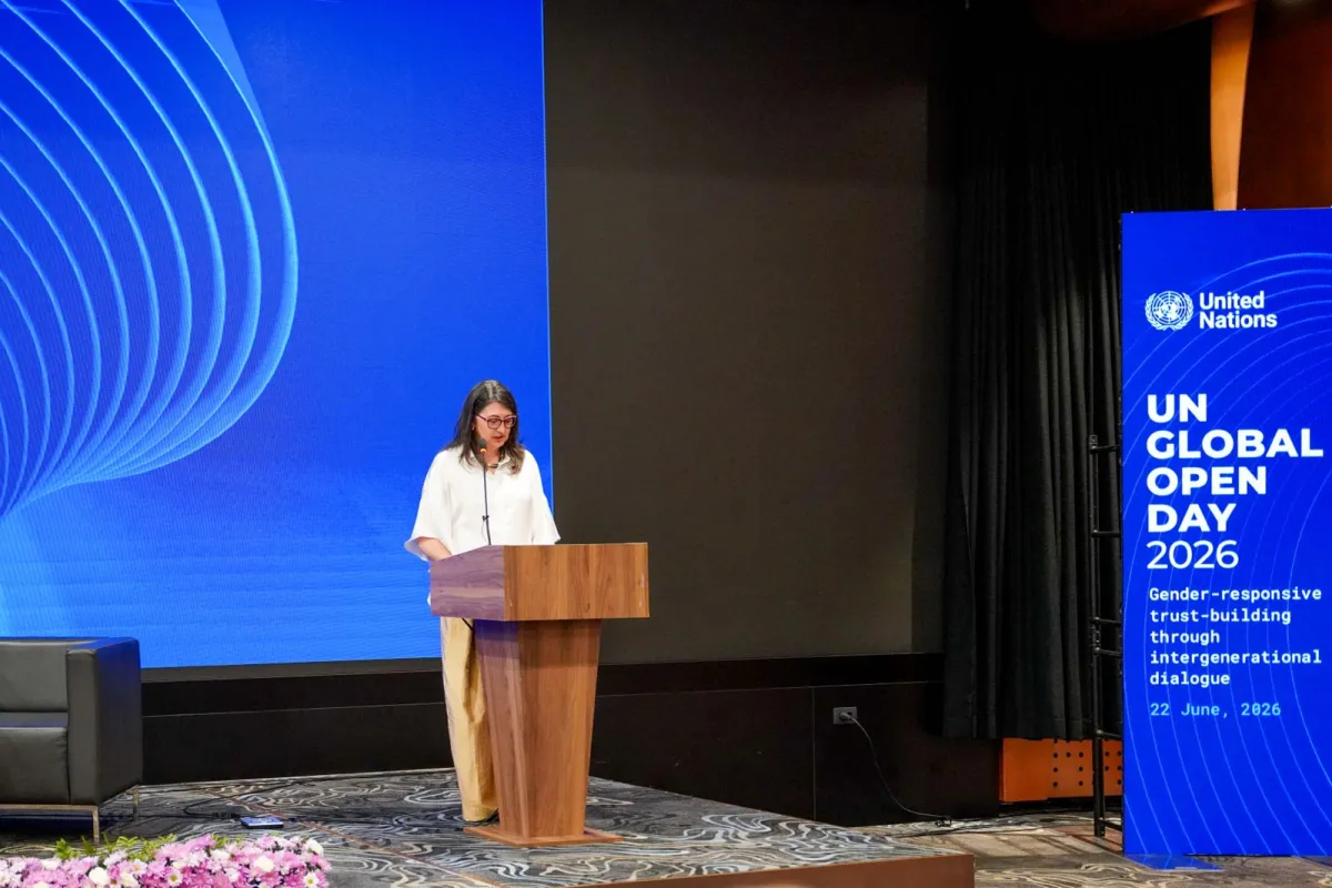 Woman speaking at podium 
