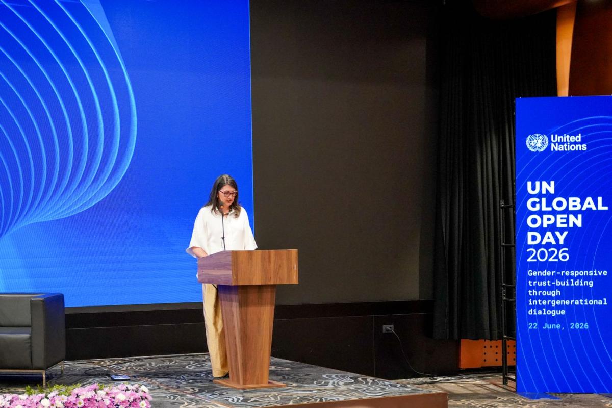 Woman speaking at podium 