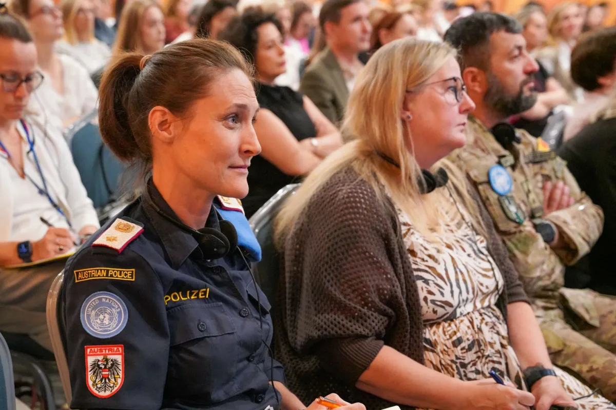 UNPOL Police officer sitting in an audience 